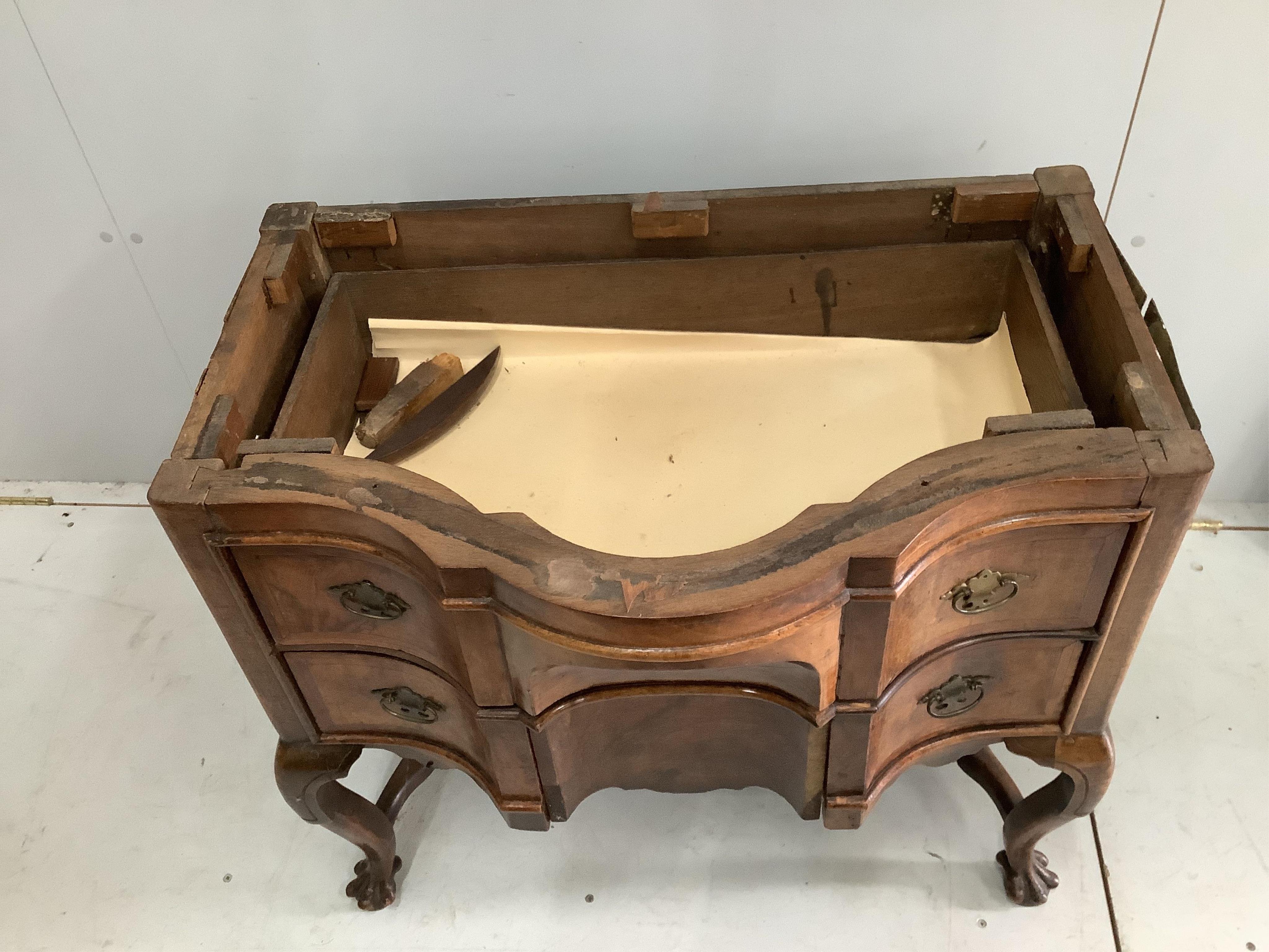 A 19th century Dutch serpentine walnut dressing table with associated triptych mirror, width 83cm. Condition - fair, some losses